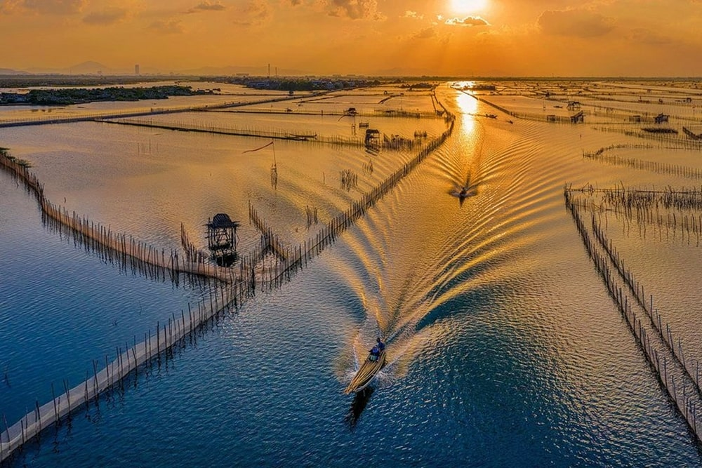 Tam Giang Lagoon is a stunning place in Hue to watch the sunrise and sunset over peaceful waters